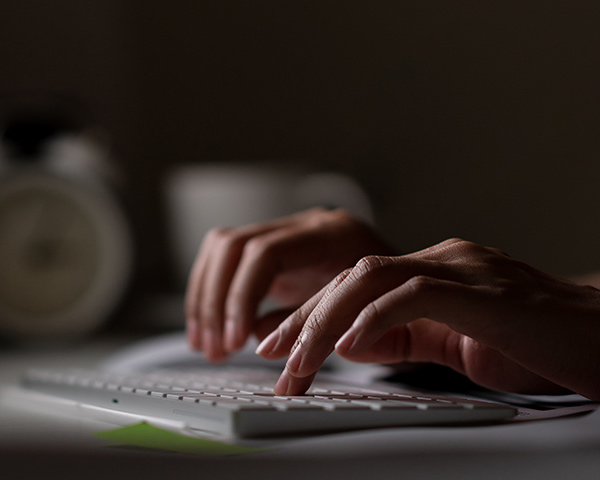 man typing on keyboard 