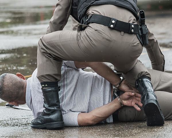 Police taking man in custody 