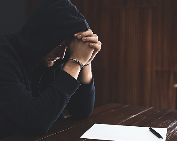 stressed man worried and handcuffed 