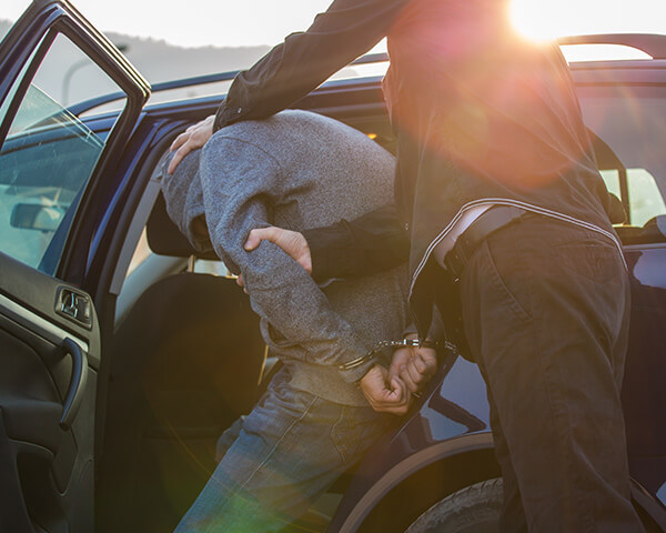 Police arresting man