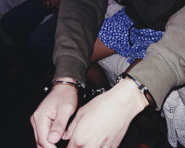 hand cuffed person 