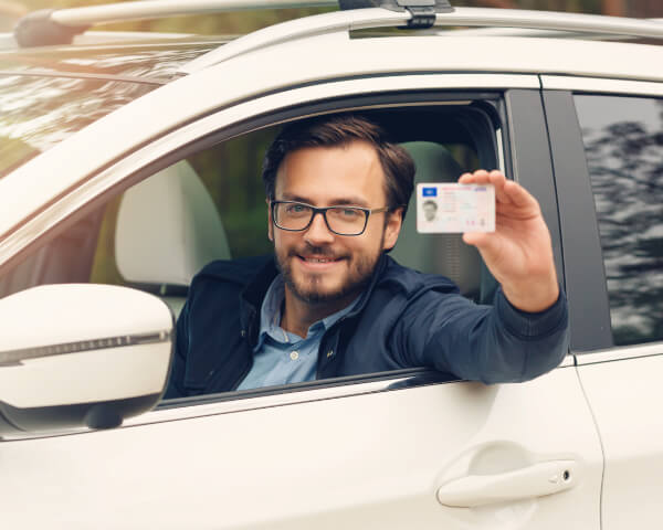 Driver showing his license 