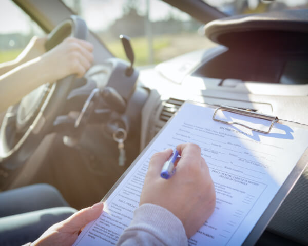 Inspector taking driving test 